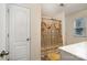 Bathroom featuring white cabinetry, a shower with gold striped curtain, and neutral walls at 1301 Waylon Ave, Gastonia, NC 28054