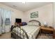 Bedroom with an artistic teal painting, large window, and decorative bedding at 1301 Waylon Ave, Gastonia, NC 28054