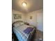 Bedroom featuring carpet, metal bed frame with patterned bedding, and neutral walls at 1301 Waylon Ave, Gastonia, NC 28054