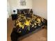 Nicely decorated bedroom with a black bed and yellow floral pattern bedding at 1301 Waylon Ave, Gastonia, NC 28054