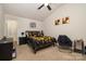 Bedroom showcasing a vaulted ceiling, ceiling fan, neutral carpet, and decorative accents at 1301 Waylon Ave, Gastonia, NC 28054