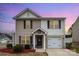Charming home with neat landscaping, covered porch and attached garage, perfect for suburban Gathering living at 1301 Waylon Ave, Gastonia, NC 28054