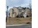 Two-story home with neutral siding, manicured lawn, and an attached garage at 1301 Waylon Ave, Gastonia, NC 28054