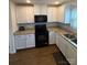 Modern kitchen with white cabinets, granite countertops, and stainless steel sink at 1301 Waylon Ave, Gastonia, NC 28054