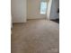 Spacious living room with natural light and neutral carpeting at 1301 Waylon Ave, Gastonia, NC 28054