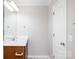 Bright bathroom features wood vanity, white countertop, and modern faucet at 136 Ridge Bluff Rd, Mooresville, NC 28115