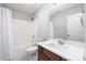 Bathroom featuring a shower-tub combo, a white shower curtain, and wood vanity at 136 Ridge Bluff Rd, Mooresville, NC 28115