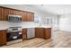 Modern kitchen with stainless steel appliances, ample cabinet space, and sleek countertops at 136 Ridge Bluff Rd, Mooresville, NC 28115