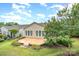 A spacious patio area is surrounded by lush landscaping providing a serene outdoor living space at 14309 Stonewater Ct, Fort Mill, SC 29707