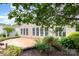 Backyard patio featuring lush greenery, beautiful landscaping, and lots of space at 14309 Stonewater Ct, Fort Mill, SC 29707
