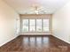 Bright bonus room featuring tile floors, ceiling fan, and plenty of natural light from large windows at 14309 Stonewater Ct, Fort Mill, SC 29707