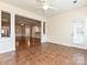 Open bonus room with tile floors and great natural light with easy access to backyard patio area at 14309 Stonewater Ct, Fort Mill, SC 29707