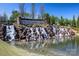 Picturesque entrance to Sun City Carolina Lakes featuring a beautiful waterfall and lush landscaping at 14309 Stonewater Ct, Fort Mill, SC 29707