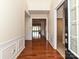 Inviting foyer with gleaming hardwood floors and elegant wainscoting, creating a grand entrance at 14309 Stonewater Ct, Fort Mill, SC 29707