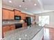 Kitchen island with granite counters and stainless steel appliances at 14309 Stonewater Ct, Fort Mill, SC 29707