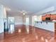 Hardwood flooring in an open concept living area showcasing the fireplace and kitchen at 14309 Stonewater Ct, Fort Mill, SC 29707