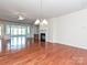 Spacious living room with fireplace and hardwood floors, open to other living spaces at 14309 Stonewater Ct, Fort Mill, SC 29707