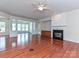 Cozy living room featuring a fireplace and seamlessly connecting to adjacent living spaces at 14309 Stonewater Ct, Fort Mill, SC 29707
