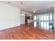 Spacious living room with hardwood floors, abundant natural light, and seamless open floor plan at 14309 Stonewater Ct, Fort Mill, SC 29707