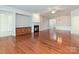 Spacious living room featuring a fireplace, built-in cabinets, and hardwood floors at 14309 Stonewater Ct, Fort Mill, SC 29707