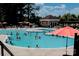 Outdoor pool area filled with swimmers and lounge chairs, perfect for summer relaxation at 14309 Stonewater Ct, Fort Mill, SC 29707