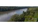 Picturesque river view with lush trees on both banks, offering a tranquil natural setting at 14309 Stonewater Ct, Fort Mill, SC 29707