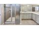 Luxurious bathroom features a glass shower, double vanity, and plenty of counter space at 15633 Aviary Orchard Way, Charlotte, NC 28278