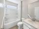 Clean bathroom featuring a shower over bath, white fixtures, and a vanity with a solid surface top at 15633 Aviary Orchard Way, Charlotte, NC 28278