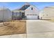 Charming two-story home with well-maintained landscaping and a spacious driveway on a sunny day at 15633 Aviary Orchard Way, Charlotte, NC 28278