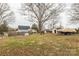 Large backyard with a boat on a trailer and a shed, perfect for outdoor activities and storage at 1611 Old Hickory Grove Rd, Mount Holly, NC 28120