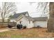 Back of house features a patio and wood deck for outdoor living at 1611 Old Hickory Grove Rd, Mount Holly, NC 28120