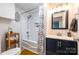 Updated bathroom with subway tile shower and navy blue vanity at 1611 Old Hickory Grove Rd, Mount Holly, NC 28120