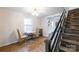 Dining area featuring hardwood floors, a modern staircase, and access to other rooms at 1611 Old Hickory Grove Rd, Mount Holly, NC 28120