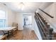 Bright dining area featuring wood floors and a staircase, perfect for Gathering meals at 1611 Old Hickory Grove Rd, Mount Holly, NC 28120