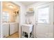 Bright laundry room features a utility sink and exterior access at 1611 Old Hickory Grove Rd, Mount Holly, NC 28120