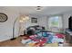 Comfortable living room featuring a sofa, decorative lighting, and a bright window at 1611 Old Hickory Grove Rd, Mount Holly, NC 28120