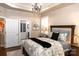 Cozy bedroom featuring a luxurious bed and a view to the attached bathroom at 16116 Lakeside Loop Ln, Cornelius, NC 28031