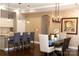 Inviting dining room with modern lighting and stylish decor, perfect for entertaining at 16116 Lakeside Loop Ln, Cornelius, NC 28031