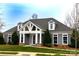 Charming exterior of a well-maintained building with beautiful landscaping at 16116 Lakeside Loop Ln, Cornelius, NC 28031