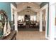 Bright and open living space with comfortable seating and a cozy fireplace at 16116 Lakeside Loop Ln, Cornelius, NC 28031