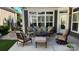 Inviting outdoor patio with cozy furniture, perfect for relaxing and entertaining at 16116 Lakeside Loop Ln, Cornelius, NC 28031