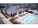 Stunning pool area with a serene pond view, perfect for relaxation and recreation at 16116 Lakeside Loop Ln, Cornelius, NC 28031