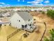 Aerial view of the house with a wooden deck, fenced backyard, and a play area at 1660 Sassafras Ct, Fort Mill, SC 29715