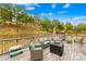 Spacious wooden deck with outdoor seating, a fire pit, and view of the backyard at 1660 Sassafras Ct, Fort Mill, SC 29715