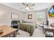 Bedroom with bed, two work stations, large window, and ceiling fan with light at 1660 Sassafras Ct, Fort Mill, SC 29715