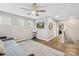 Light and bright bonus room features a ceiling fan, wall mounted TV, and a day bed at 1660 Sassafras Ct, Fort Mill, SC 29715