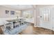 Bright dining room with wood floors, wainscoting, an elegant chandelier, and natural light at 1660 Sassafras Ct, Fort Mill, SC 29715