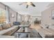 Open-concept living room featuring hardwood floors, neutral tones, and seamless flow to the kitchen at 1660 Sassafras Ct, Fort Mill, SC 29715