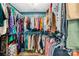 Fully organized walk-in closet with metal shelving with hanging rods at 1660 Sassafras Ct, Fort Mill, SC 29715