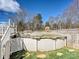 Backyard features a partially above-ground pool that needs some TLC at 170 Louise Dr, Mooresville, NC 28115